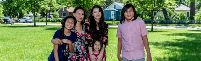 Smiling Native American woman, Jamie, and her four smiling children
