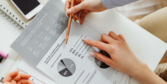 Image Of People Looking At Charts